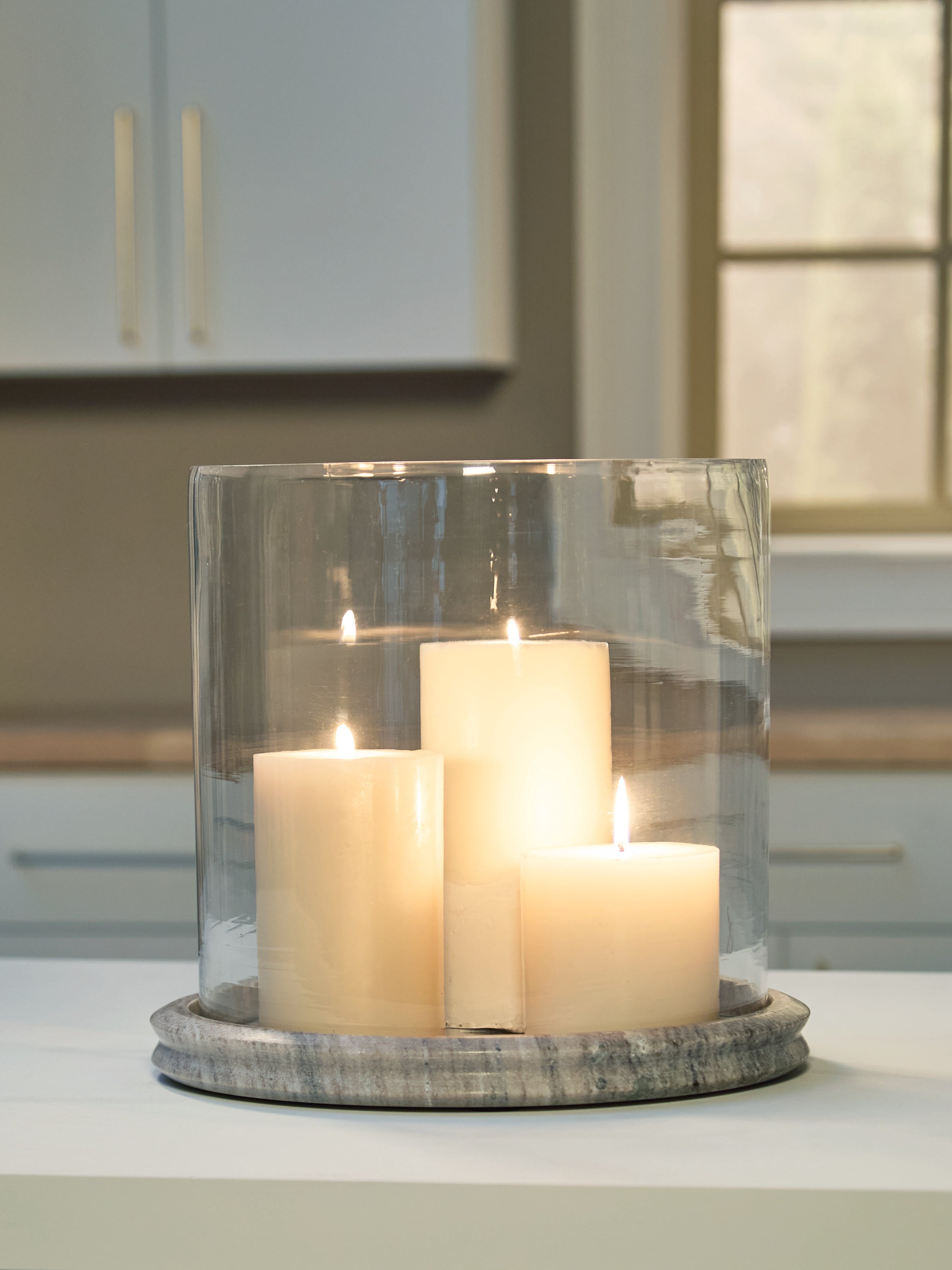 Hoover Furniture Outlet - Ashley Furniture - Saskia Candle Holder - Candle Holder / Clear/Beige - A2000847