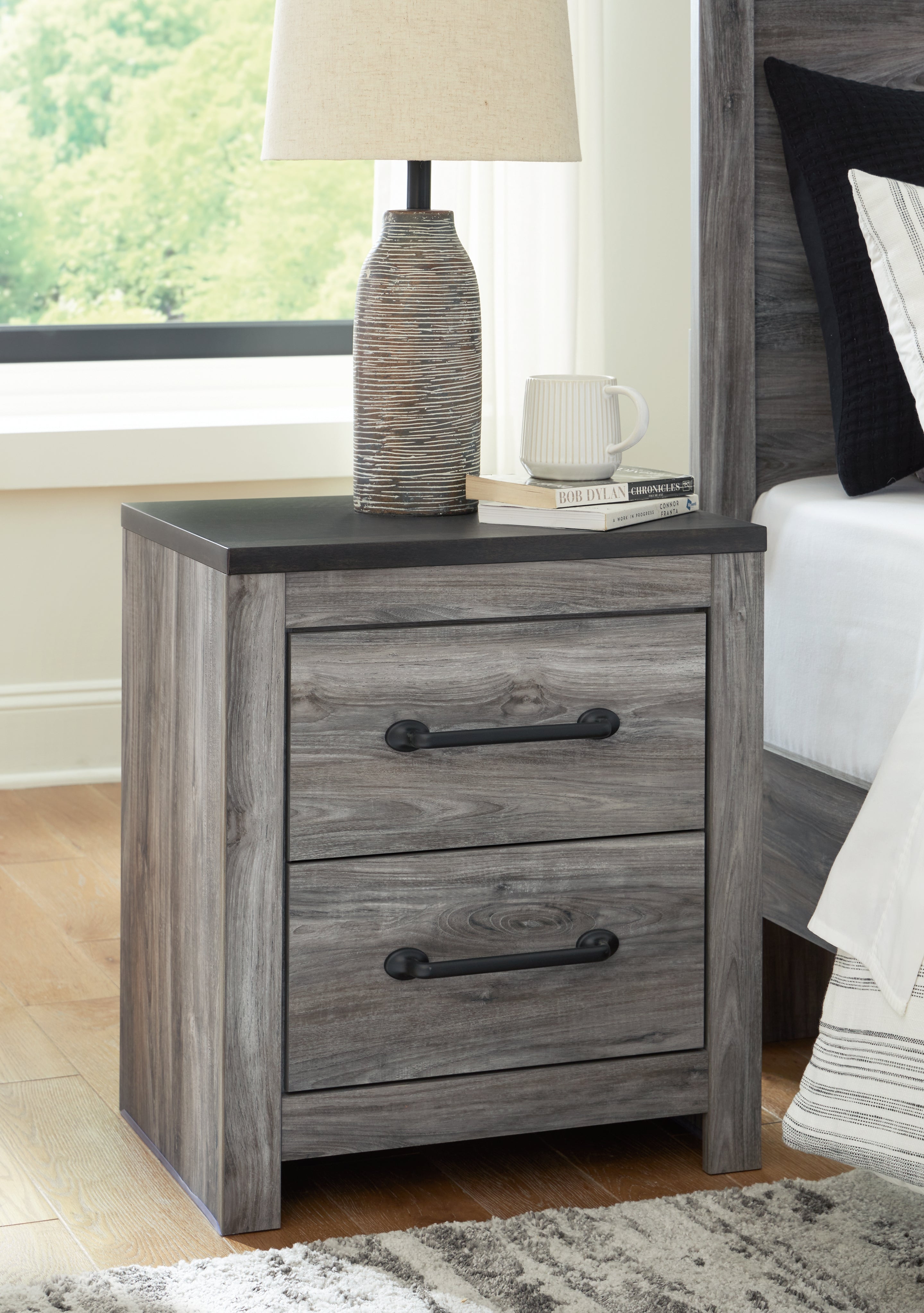 Hoover Furniture Outlet - Ashley Furniture - Bronyan Nightstand - Two Drawer Night Stand / Dark Gray - B1290-92