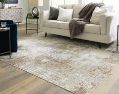 Hoover Furniture Outlet - Ashley Furniture - Grifflain 7'10" x 10'3" Washable Rug - 7'10" x 10'3" Washable Rug / Tan/Brown/Gray - R406231