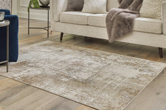 Hoover Furniture Outlet - Ashley Furniture - Grifflain 5'1" x 7' Washable Rug - 5'1" x 7' Washable Rug / Tan/Brown/Gray - R406232